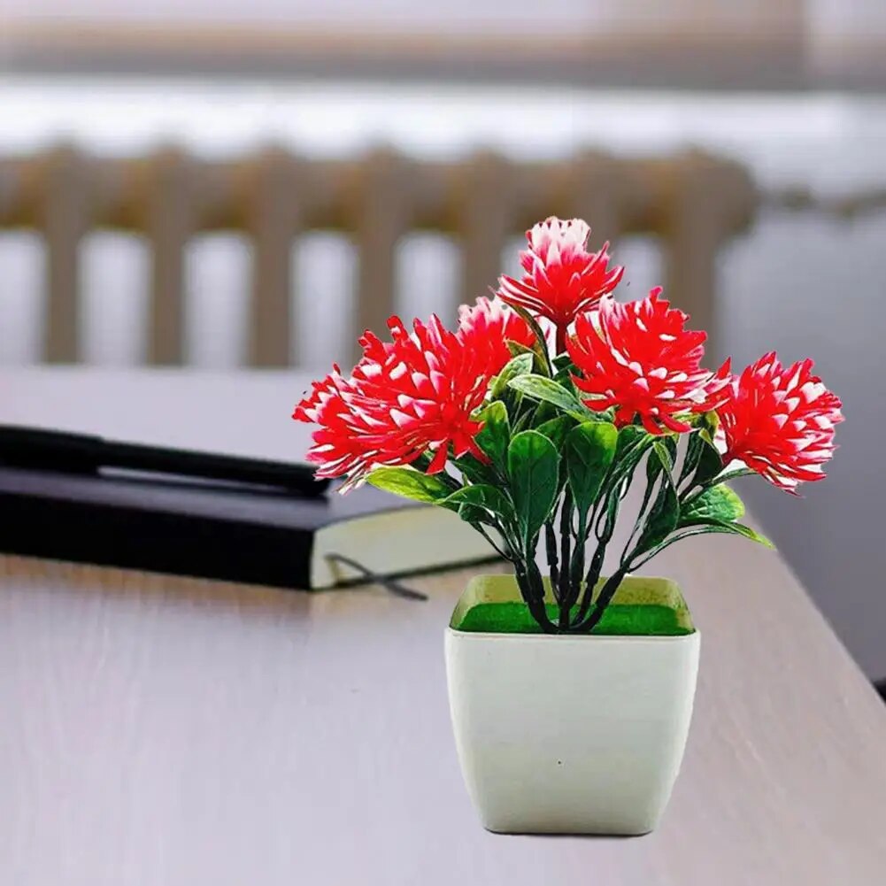 مجموعة واحدة من الزهور الاصطناعية المزروعة في أصيص