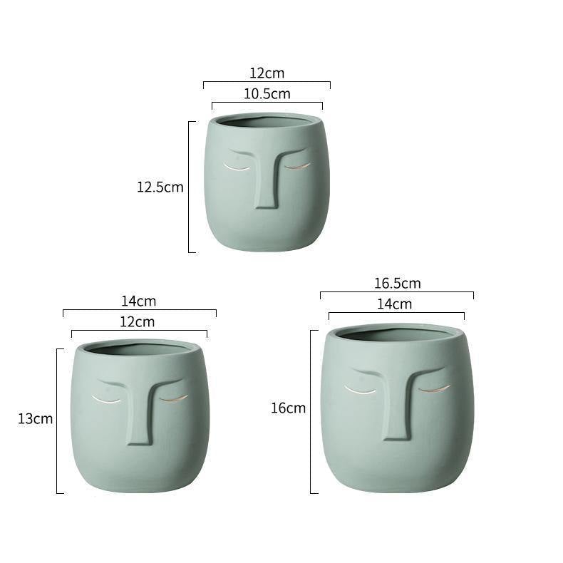 وعاء خزفي على شكل وجه نائم تجريدي